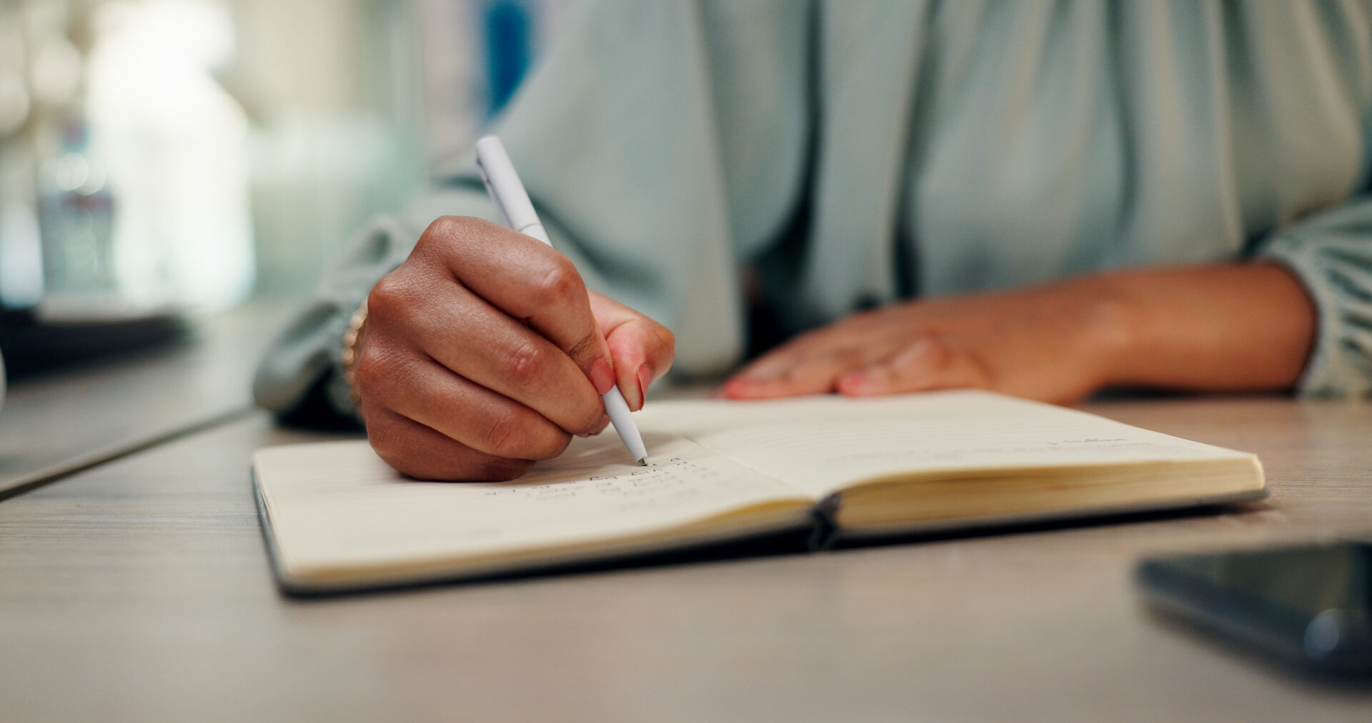 Person taking notes at a desk